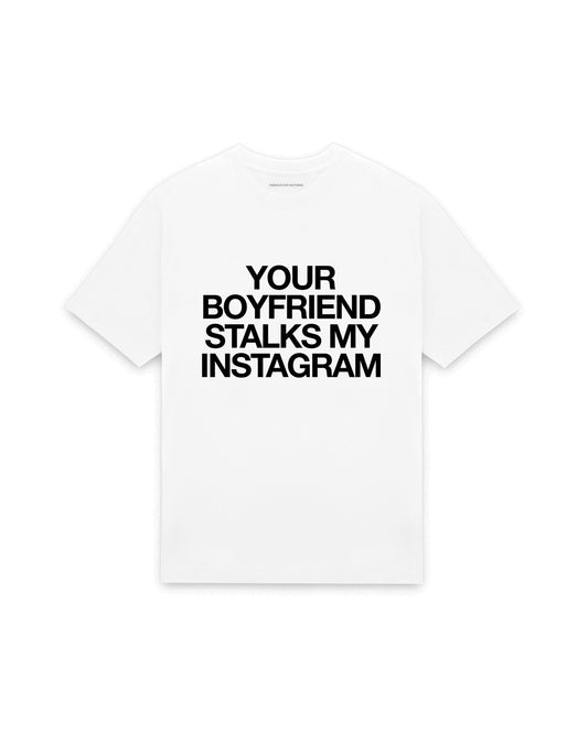 White oversized t-shirt with YOUR BOYFRIEND STALKS MY INSTAGRAM printed in Helvetica across the chest, AS Colour Heavy Tee 5080.