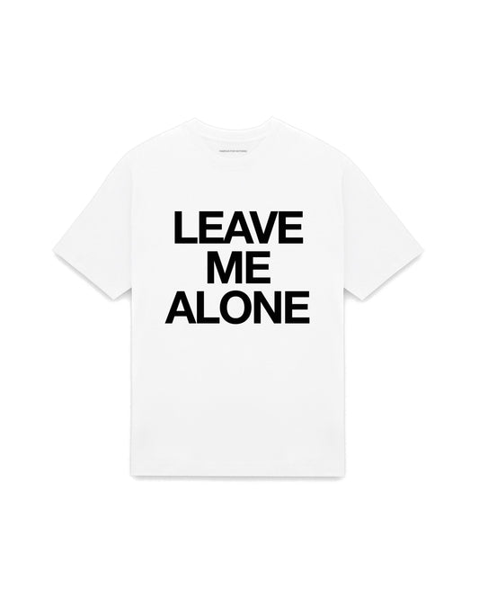 White oversized t-shirt with LEAVE ME ALONE printed in Helvetica across the chest, AS Colour Heavy Tee 5080.