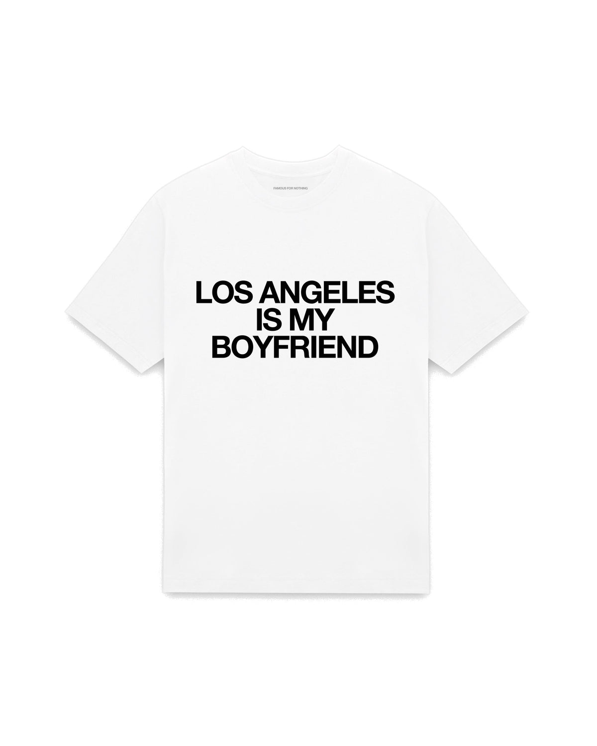 White oversized t-shirt with LOS ANGELES IS MY BOYFRIEND printed in Helvetica across the chest, AS Colour Heavy Tee 5080.