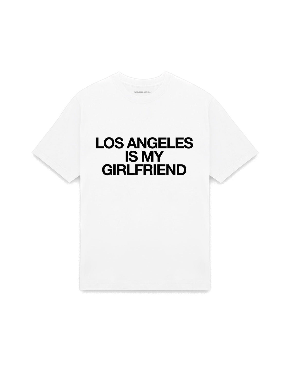 White oversized t-shirt with LOS ANGELES IS MY GIRLFRIEND printed in Helvetica across the chest, AS Colour Heavy Tee 5080.