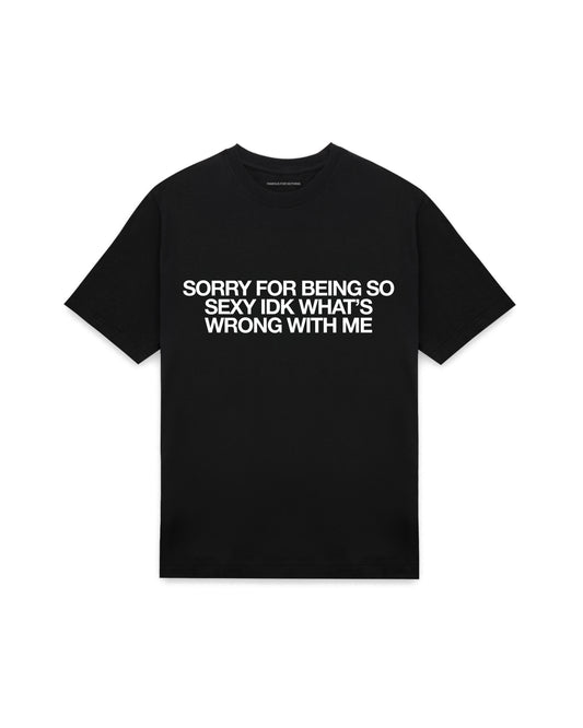 Black oversized t-shirt with SORRY FOR BEING SO SEXY IDK WHATS WRONG WITH ME printed in Helvetica across the chest, AS Colour Heavy Tee 5080.