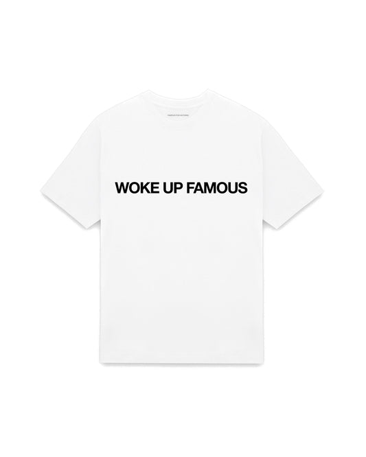White oversized t-shirt with WOKE UP FAMOUS printed in Helvetica across the chest, AS Colour Heavy Tee 5080.